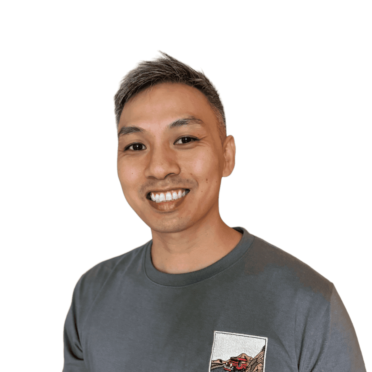 Billy Le smiling in a gray t-shirt